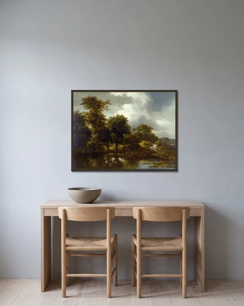 Skogslandskap med damm av Jacob van Ruisdael inramad på en vägg