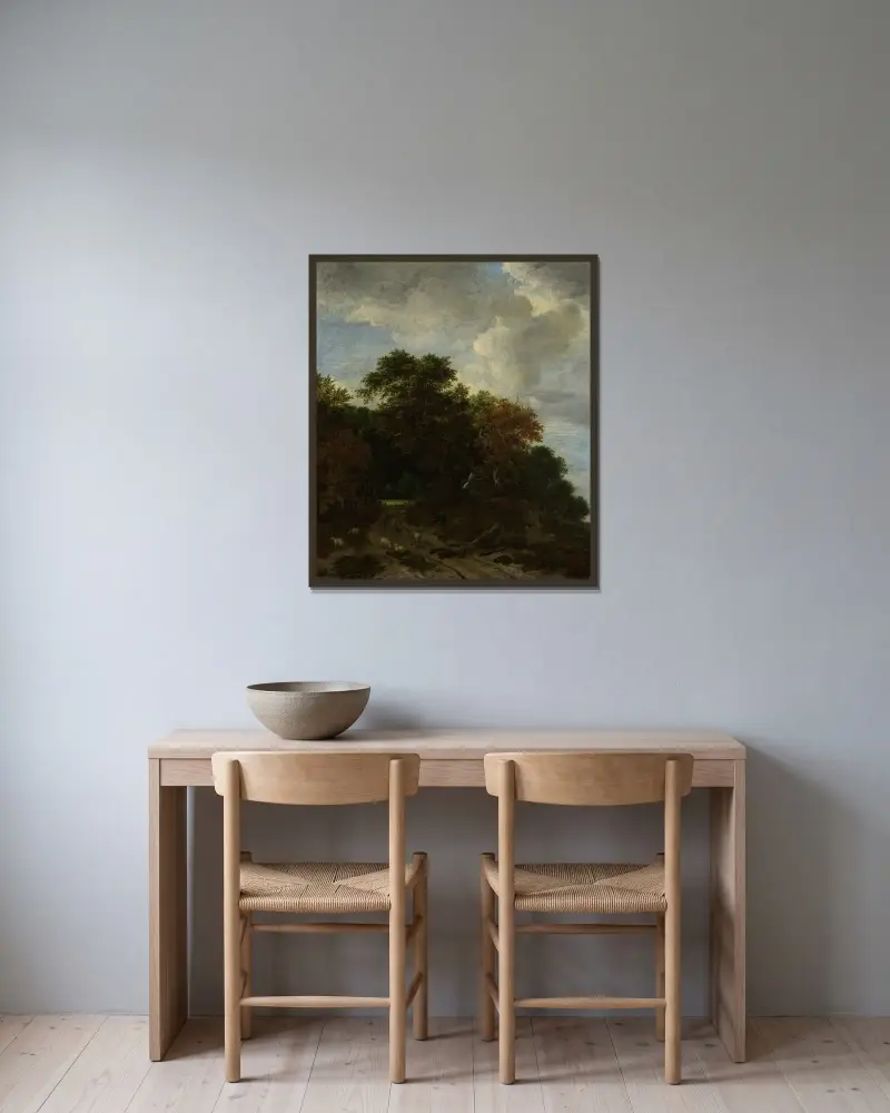 Skogslandskap av Jacob van Ruisdael inramad på en vägg