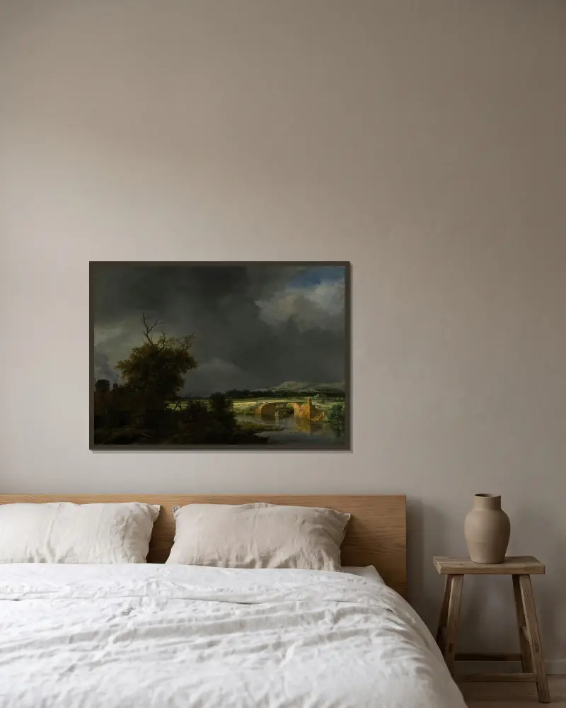 Landskap med stuga och stenbro under molnig himmel av Jacob van Ruisdael inramad på en vägg