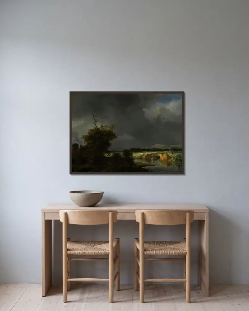 Landskap med stuga och stenbro under molnig himmel av Jacob van Ruisdael inramad på en vägg