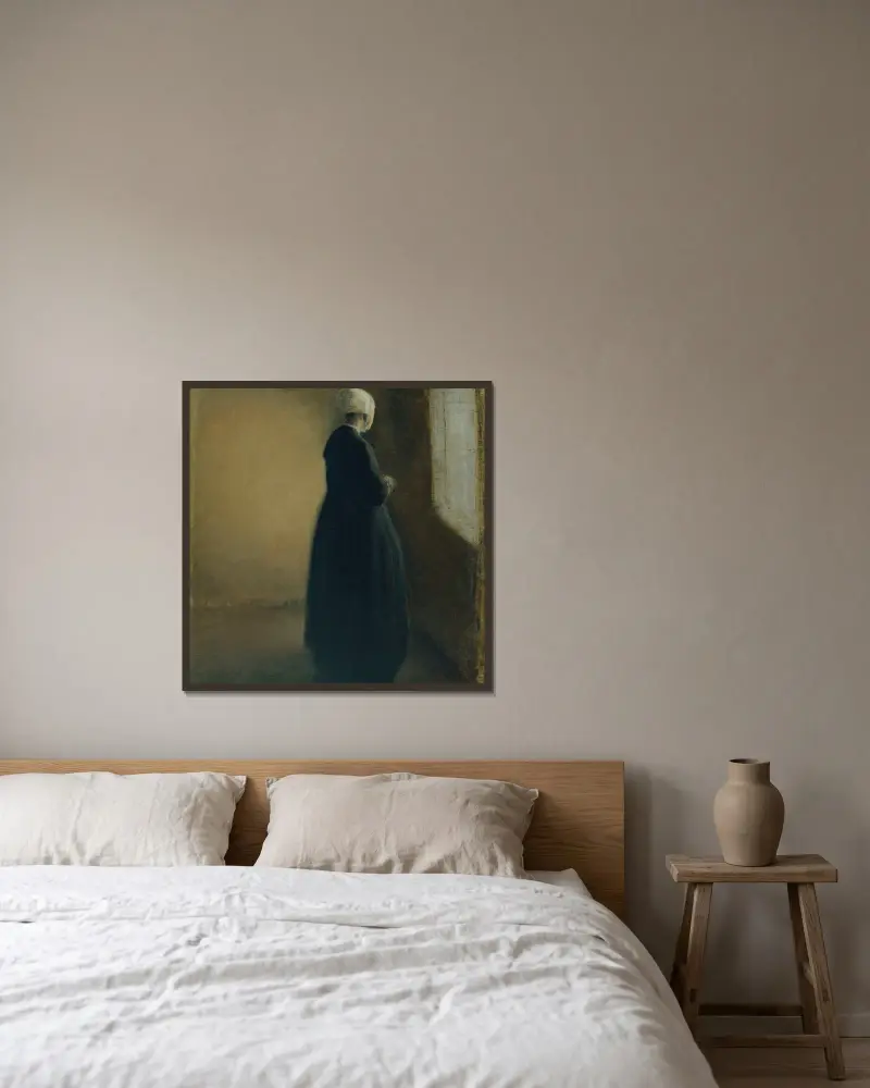 An old woman standing by a window av Vilhelm Hammershøi inramad på en vägg