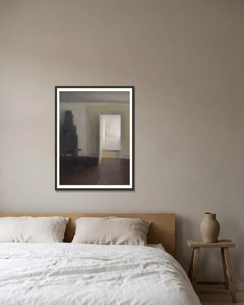 Interieur. Ein alter Ofen von Vilhelm Hammershøi gerahmt an einer Wand