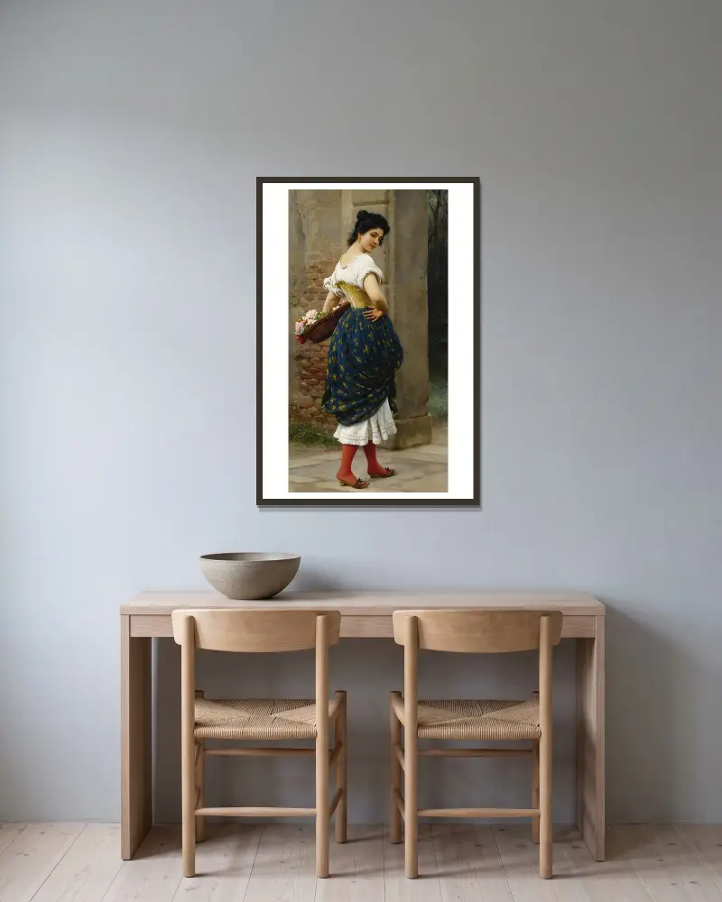 En ung kvinna med en korg rosor av Eugen von Blaas inramad på en vägg