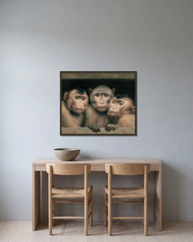 Tre apor av Gabriel von Max inramad på en vägg