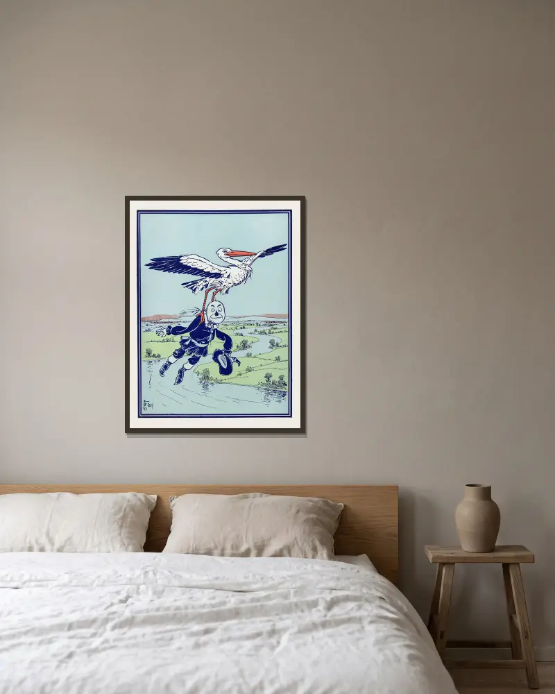 The Stork carried him up into the air av William Wallace Denslow inramad på en vägg