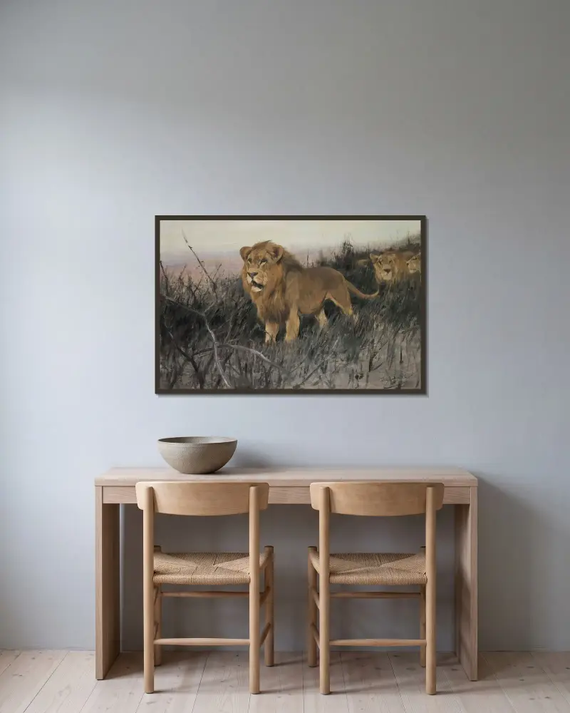 Löwen in verbrannter Steppe von Wilhelm Kuhnert gerahmt an einer Wand