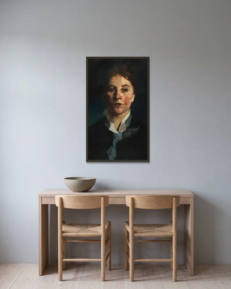 Flicka med vit krage, en face av Wilhelm Trübner inramad på en vägg