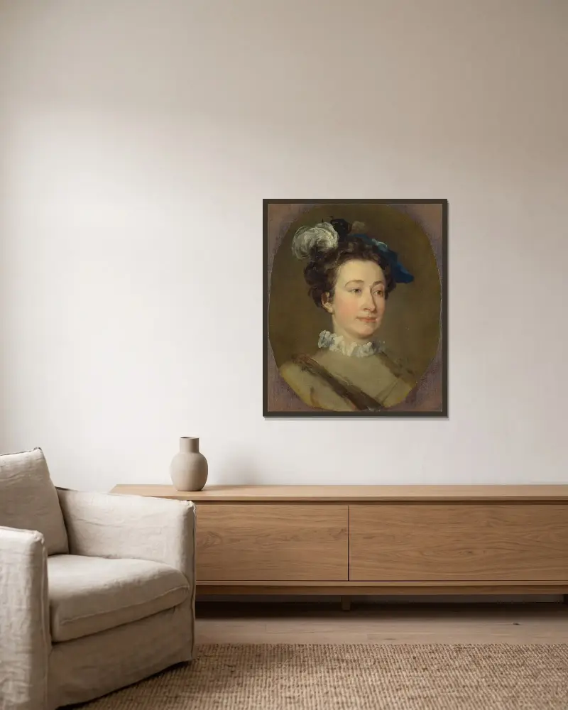 Flicka i plymad hatt av William Hogarth inramad på en vägg