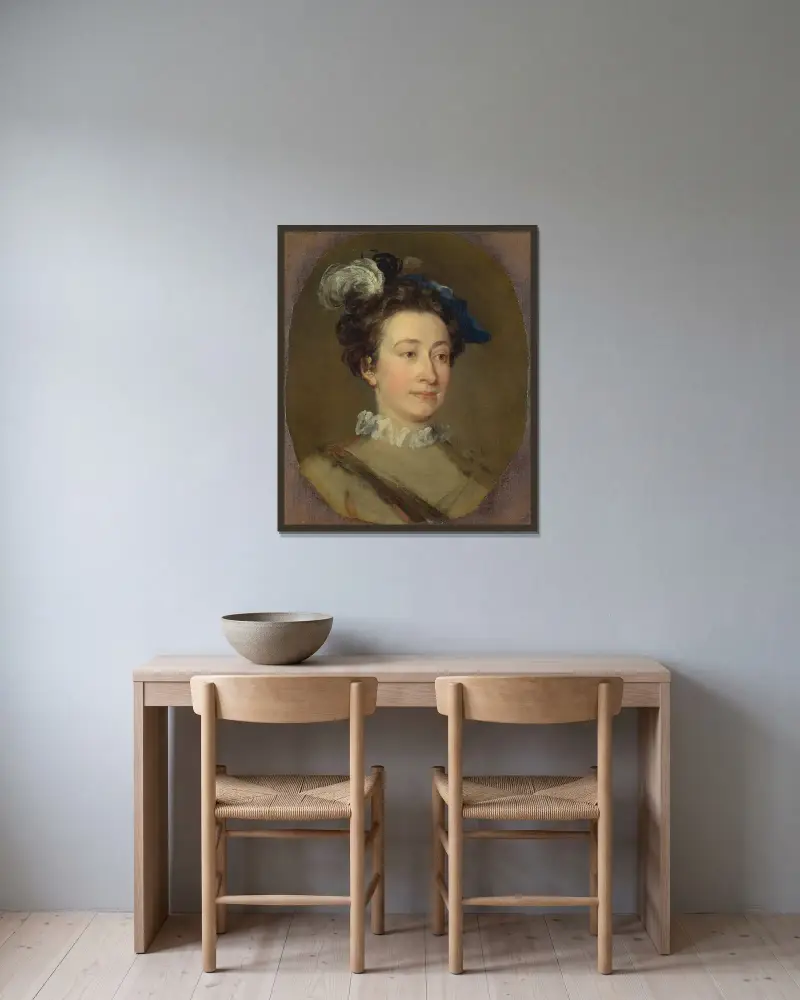 Flicka i plymad hatt av William Hogarth inramad på en vägg