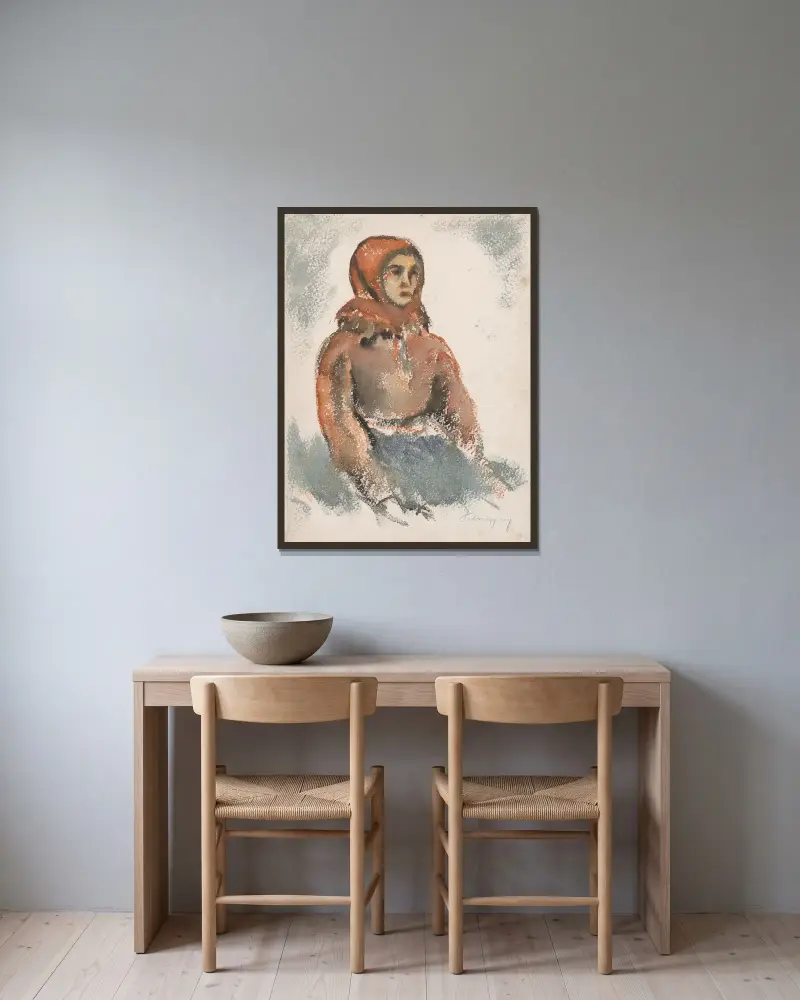 Sittande flicka med röd yllesjal av Zolo Palugyay inramad på en vägg