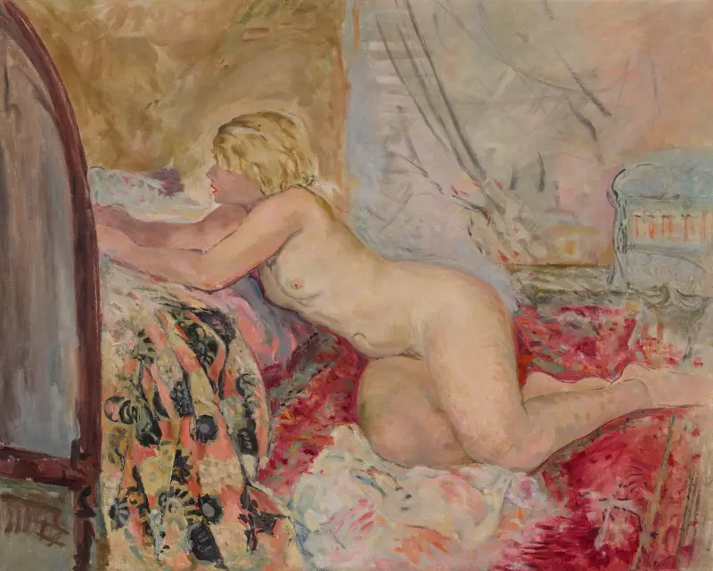 Naken kvinna liggande mot en säng (Marinette) av Henri Lebasque
