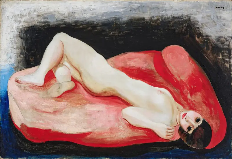 Akt liegend auf einem roten Sofa von Moïse Kisling