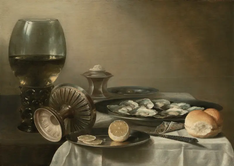 A large roemer, overturned tazza, salt cellar, partially sliced lemon, oysters, pepper, knife and bread on a partially draped table av Pieter Claesz