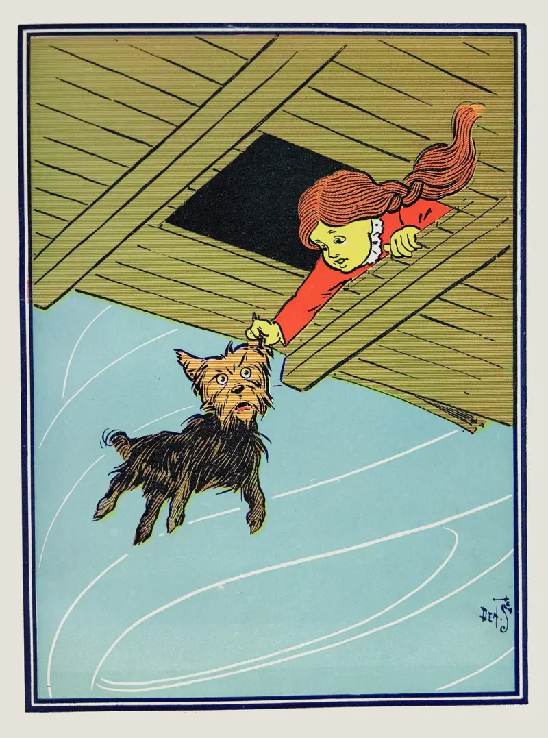 She caught Toto by the ear av William Wallace Denslow