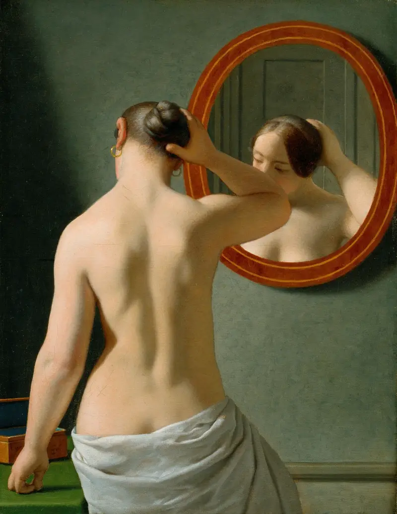 En naken kvinna som gör sin frisyr framför en spegel av Christoffer Wilhelm Eckersberg